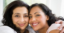 Mother and daughter embracing.