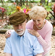 Husband and wife gardening together.