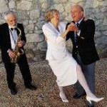Sax player with husband and wife dancing.