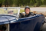 Older couple driving a roadster