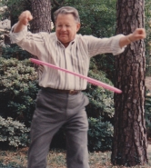 Older man using a hula hoop